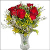 6 Red Roses arranged in a  Small  Crystal vase.                       